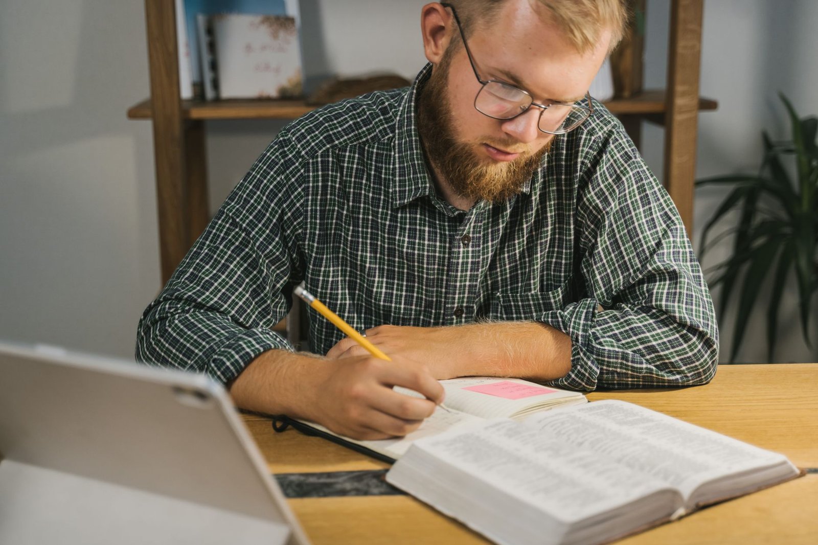 Person studying the Bible at a desk