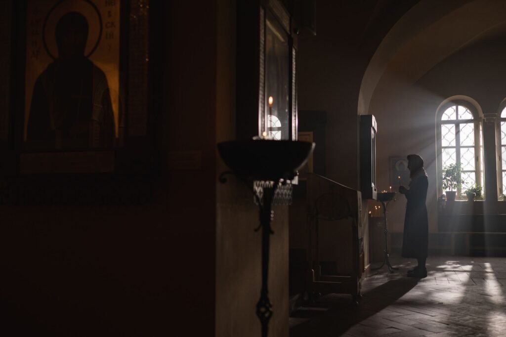 A woman in prayer, seeking God’s guidance and strength