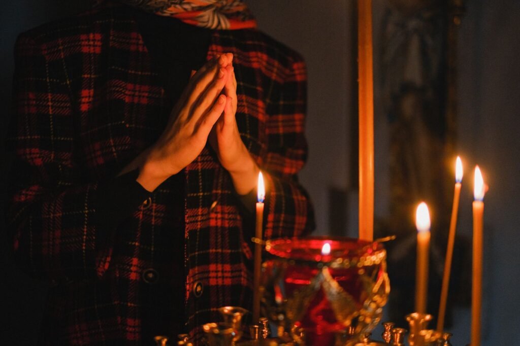 A woman praying outdoors, seeking God’s guidance and comfort amidst her stress